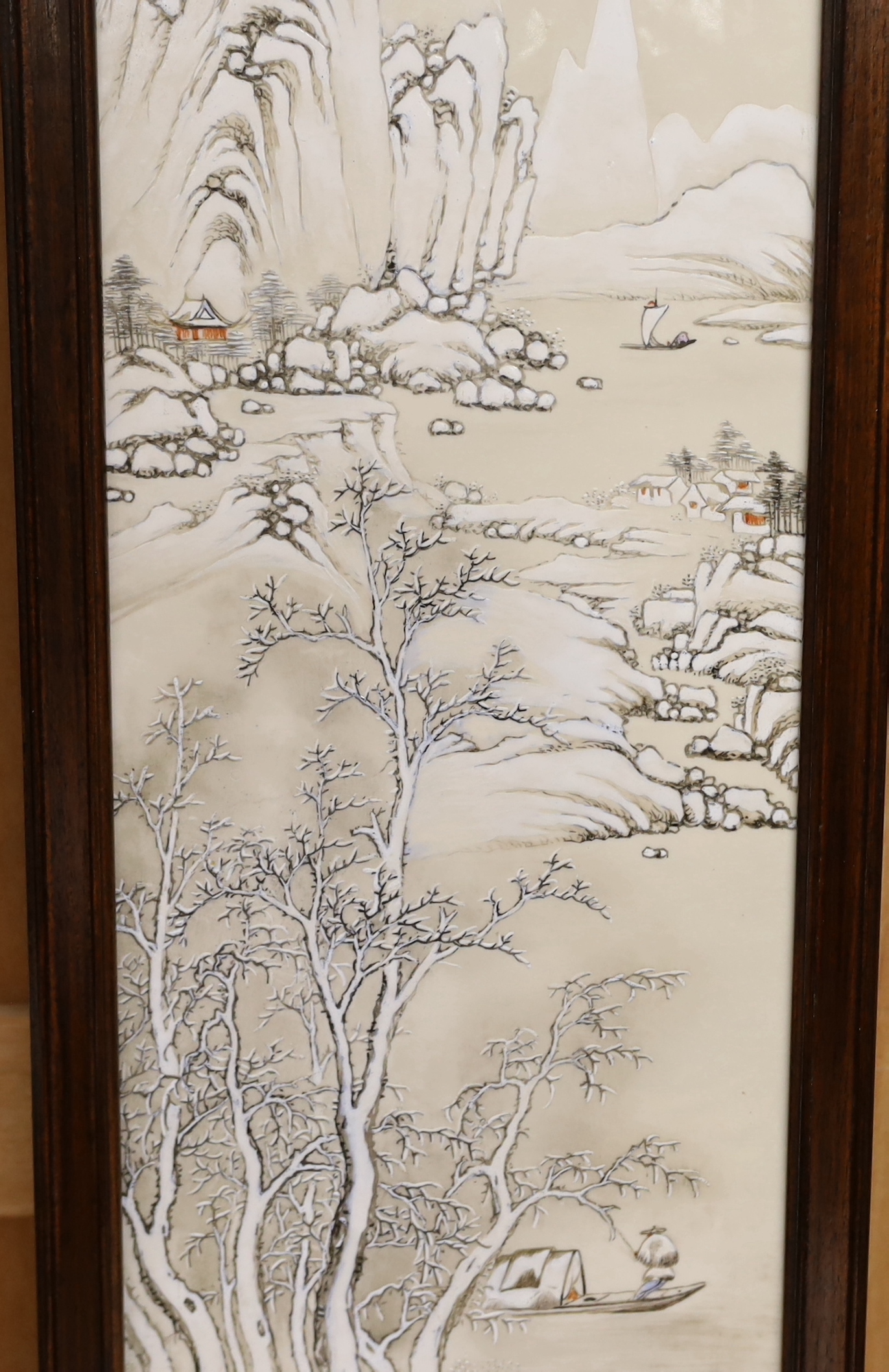 An early 20th century Chinese enamelled porcelain 'winter scene' plaque, framed, 85 x 25cm total